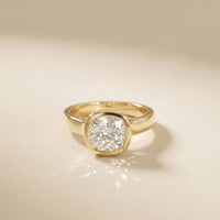 Gold ring with a diamond on a beige background Gold