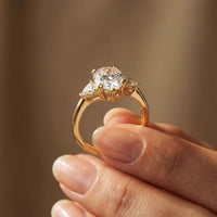 2.40 Ct Pear Cut Moissanite Three Stone Ring Gold
