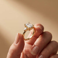 5.08 Ct Emerald Moissanite with Pear Side Stones Refined Accent Engagement Ring