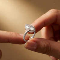 3.9 Ct Pear Cut Moissanite Halo Ring with Accent Stones
