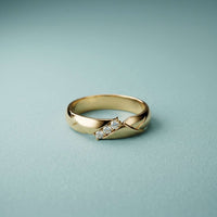 0.07 Ct Round Cut Criss-Cross Accent Moissanite Ring