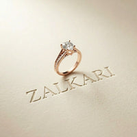 2.30 Ct Pear Cut Moissanite Tapered Pavé Engagement Ring