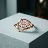 1.25 Ct Pear Cut Moissanite Bezel Solitaire Ring Rose Gold