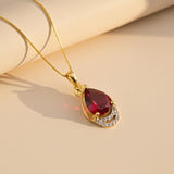 Silver Teardrop Ruby Pendant with CZ Curve