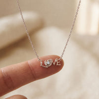 0.10CTW Round Cut Lab Grown Diamond LOVE Letter Pendant Necklace for Women White