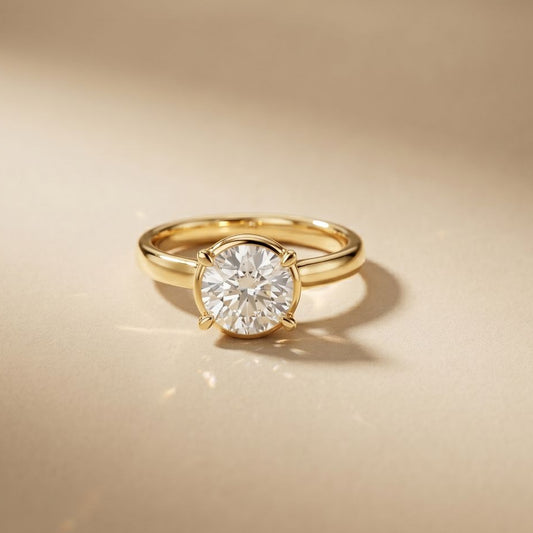 Gold ring with a diamond on a beige background