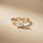 Gold ring with a diamond on a beige background Gold