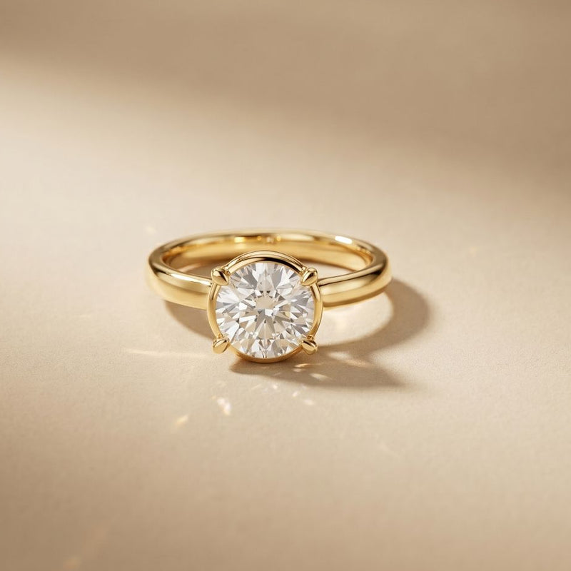 Gold ring with a diamond on a beige background Gold