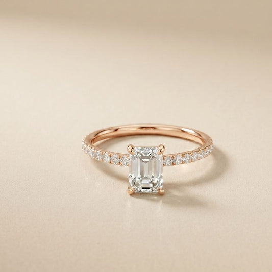 Rose gold ring with a diamond on a beige background