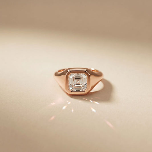 Rose gold ring with a diamond on a beige background