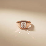 Rose gold ring with a diamond on a beige background Rose Gold