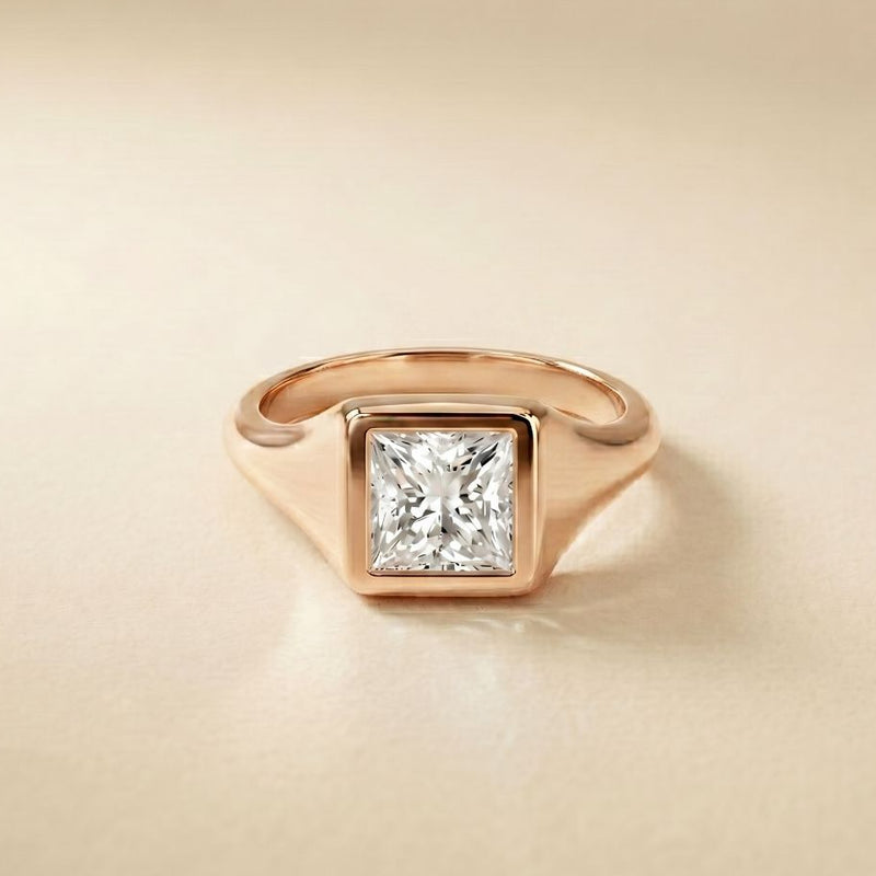 Rose gold ring with a diamond on a beige background Rose Gold