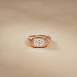 Rose gold ring with a diamond on a beige background Rose Gold