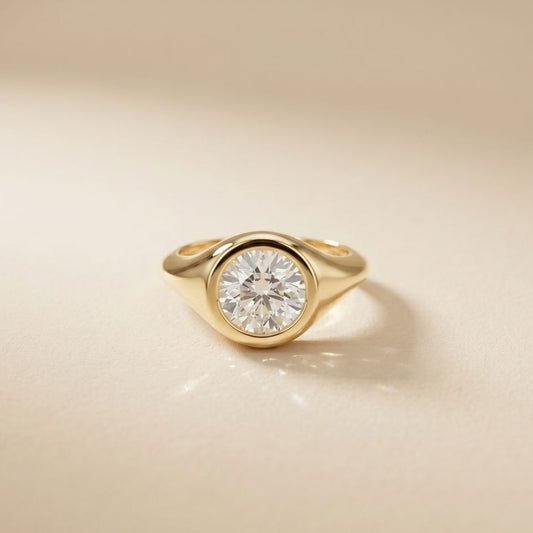 Gold ring with a diamond on a beige background