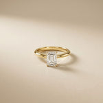 Gold ring with a diamond on a beige background Gold