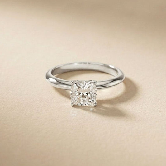 Diamond ring on a beige background