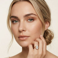 Woman wearing a diamond ring on a neutral background Rose Gold