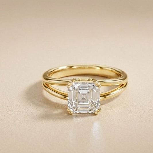 Gold ring with a diamond on a beige background