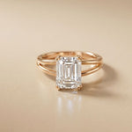 Rose gold ring with a large diamond on a beige background Rose Gold