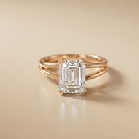 Rose gold ring with a large diamond on a beige background Rose Gold