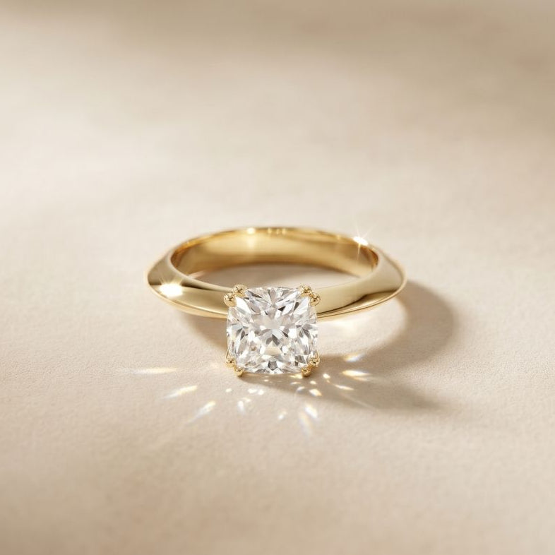 Gold ring with a diamond on a beige background Gold