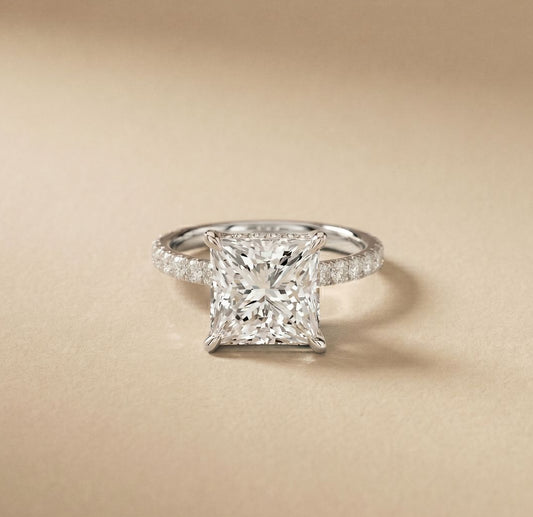 Diamond ring with a beige background White