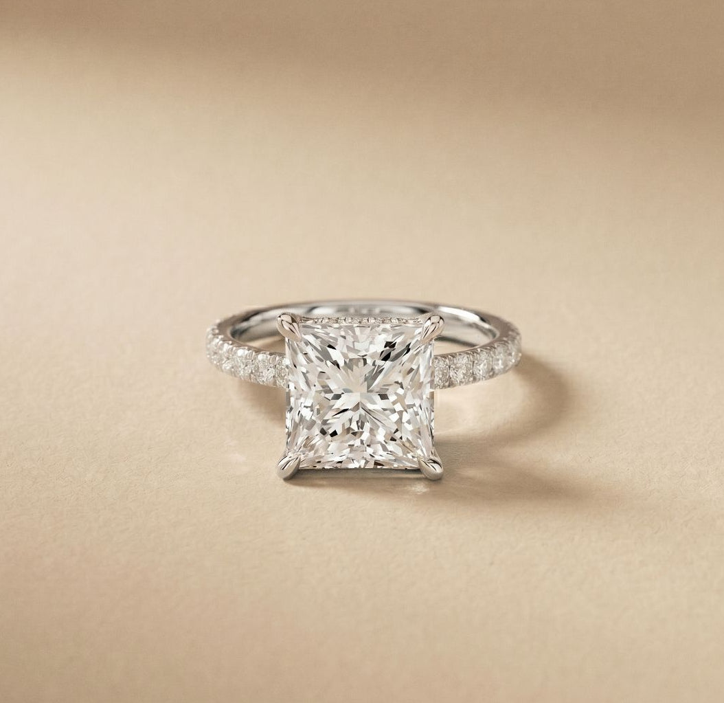 Diamond ring with a beige background White