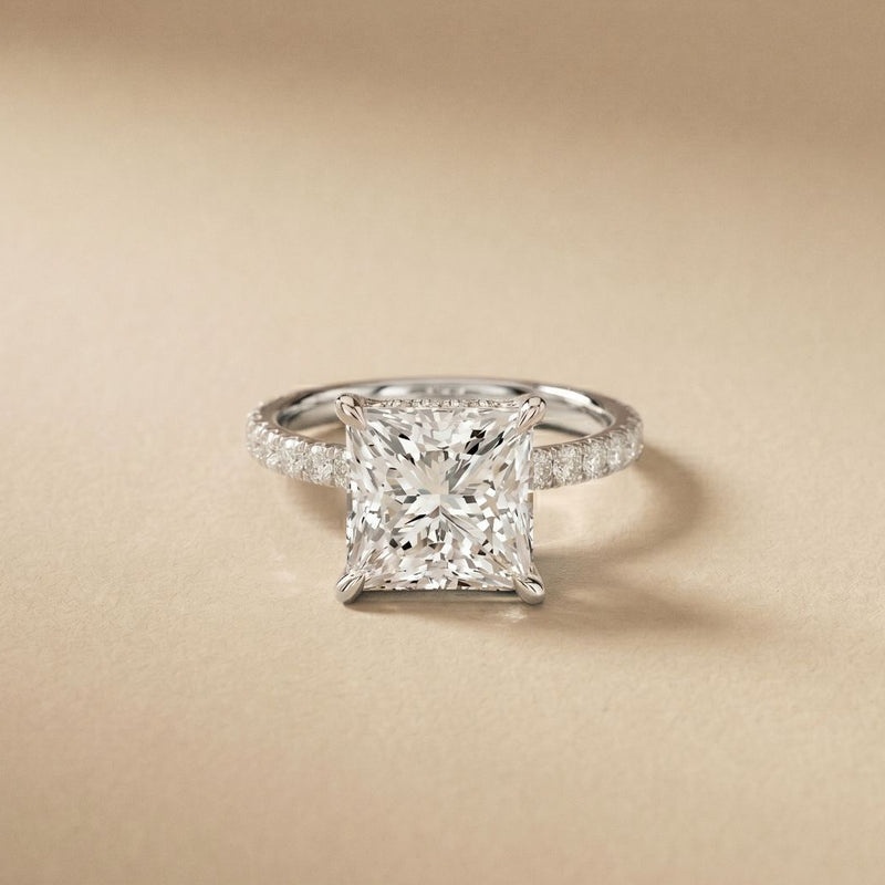 Diamond ring with a beige background White
