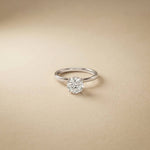 Diamond ring on a beige background White