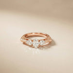 0.75 Ct Pear Moissanite Trilogy Elegance Ring