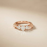 0.75 Ct Pear Moissanite Trilogy Elegance Ring