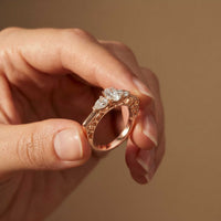 0.75 Ct Pear Moissanite Trilogy Elegance Ring