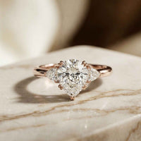 2.40 Ct Pear Cut Moissanite Three Stone Ring Rose Gold