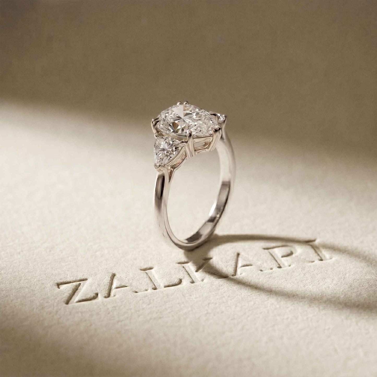2.3 Ct Pear Cut Moissanite Solitaire Three Stone Ring