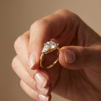 2.3 Ct Round & Trillion Moissanite Three Stone Elegance Ring