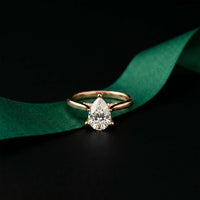 2.14 Ct Pear Moissanite Pavé Bridge Elegant Engagement Ring