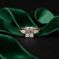 5.08 Ct Emerald Moissanite with Pear Side Stones Refined Accent Engagement Ring