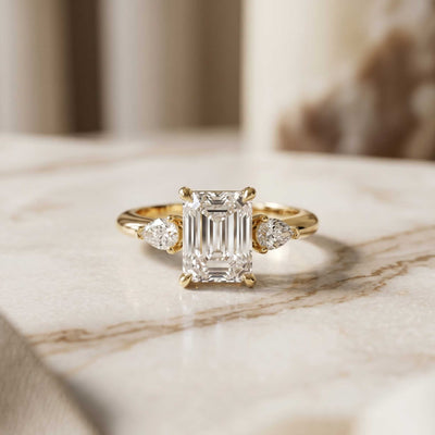 5.10 Ct Emerald Moissanite with Pear Side Stones Refined Accent Engagement Ring