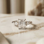 5.08 Ct Emerald Moissanite with Pear Side Stones Refined Accent Engagement Ring