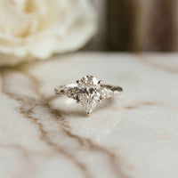 3.27 Ct Pear Moissanite with Pear Side Stones Graceful Fusion Engagement Ring
