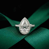 3.9 Ct Pear Cut Moissanite Halo Ring with Accent Stones