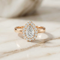 0.71 Ct Pear & Round Moissanite Halo Ring