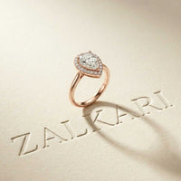0.71 Ct Pear & Round Moissanite Halo Ring