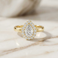 0.71 Ct Pear & Round Moissanite Halo Ring