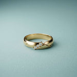 0.07 Ct Round Cut Criss-Cross Accent Moissanite Ring