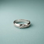0.07 Ct Round Cut Criss-Cross Accent Moissanite Ring