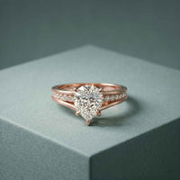 2.30 Ct Pear Cut Moissanite Tapered Pavé Engagement Ring