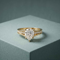 2.30 Ct Pear Cut Moissanite Tapered Pavé Engagement Ring
