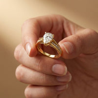 2.30 Ct Pear Cut Moissanite Tapered Pavé Engagement Ring