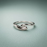 0.10 Ct Round Cut Modern Open Swirl Moissanite Ring White